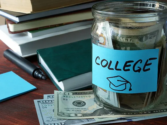 Jar with label and money on the table.